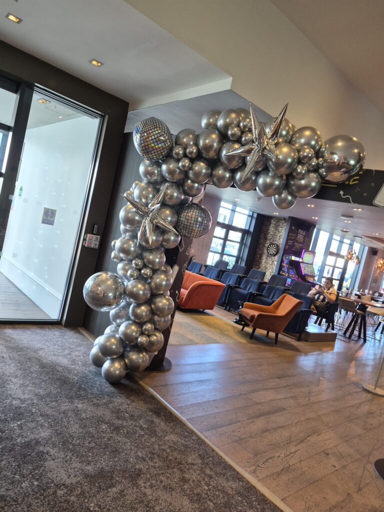 Silver balloon arch